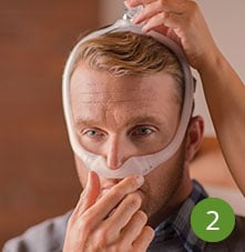 man wearing sleep apnea mask
