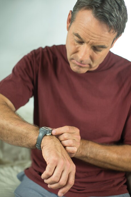 Man setting clock