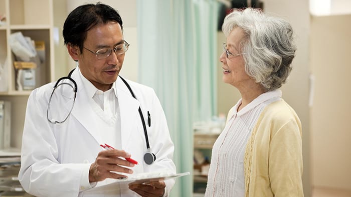 Doctor and patient in Indonesia -  